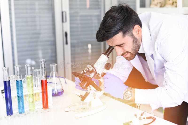 Male Scientists or Doctor in lab biochemistry genetics forensics microbiology and test tube - Scientist research working together