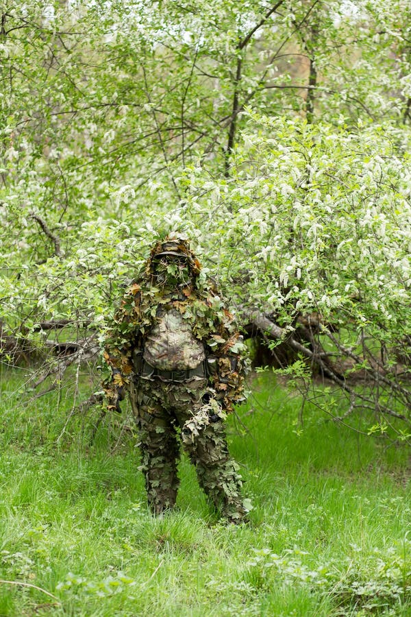 A Camouflaged Sniper Sitting In The Woods Aiming Through His Scope Stock  Photo, Picture and Royalty Free Image. Image 42659284.