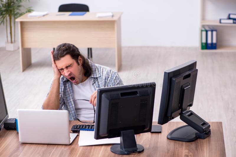 Young male it specialist working in the office stock image