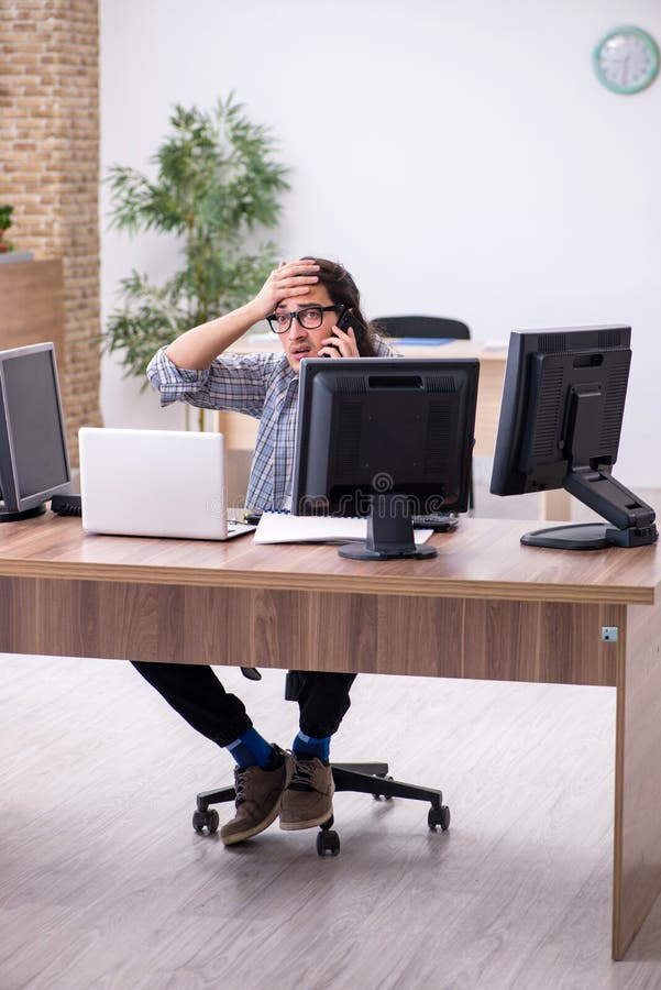 Young male it specialist working in the office royalty free stock images