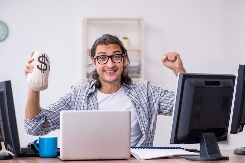 Young male it specialist working in the office stock image