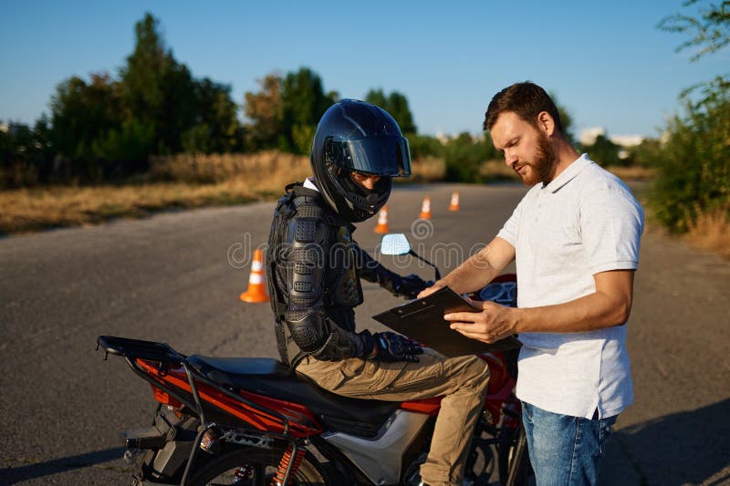 Male student and instructor, motorcycle school royalty free stock photo