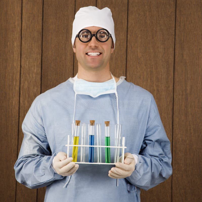Male surgeon holding test tubes.