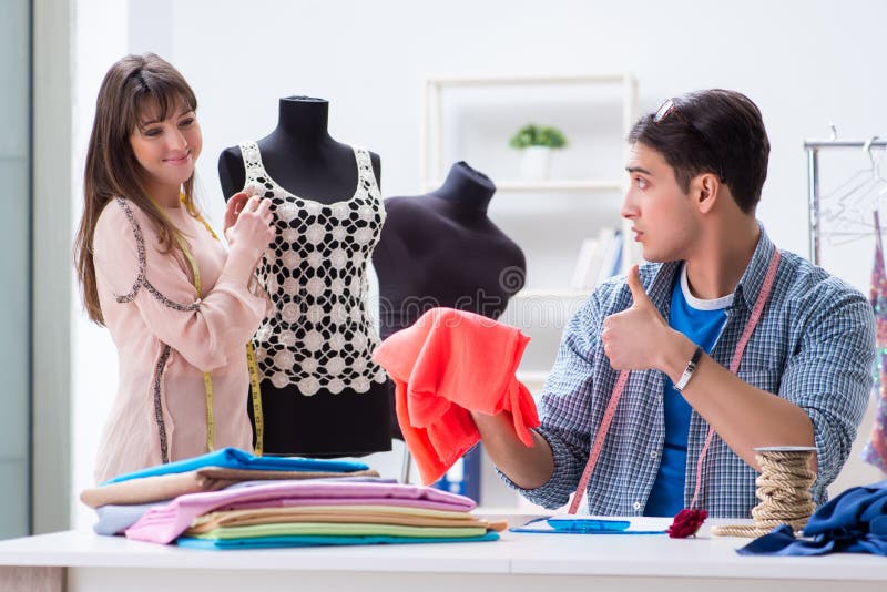 The Male Tailor with Female Student in Workshop Stock Image - Image of ...