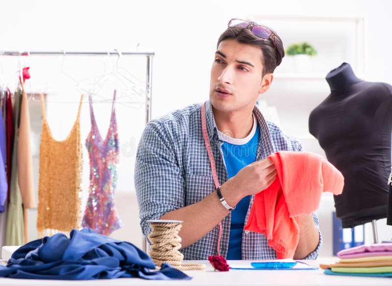 Male Tailor with Female Student in Workshop Stock Image - Image of ...