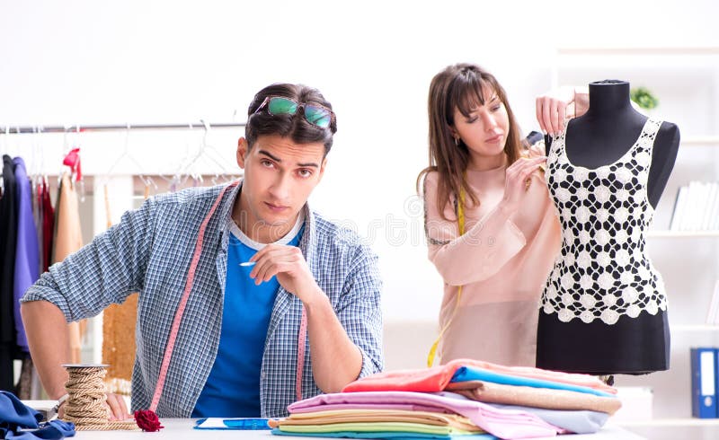 Male Tailor with Female Student in Workshop Stock Photo - Image of ...