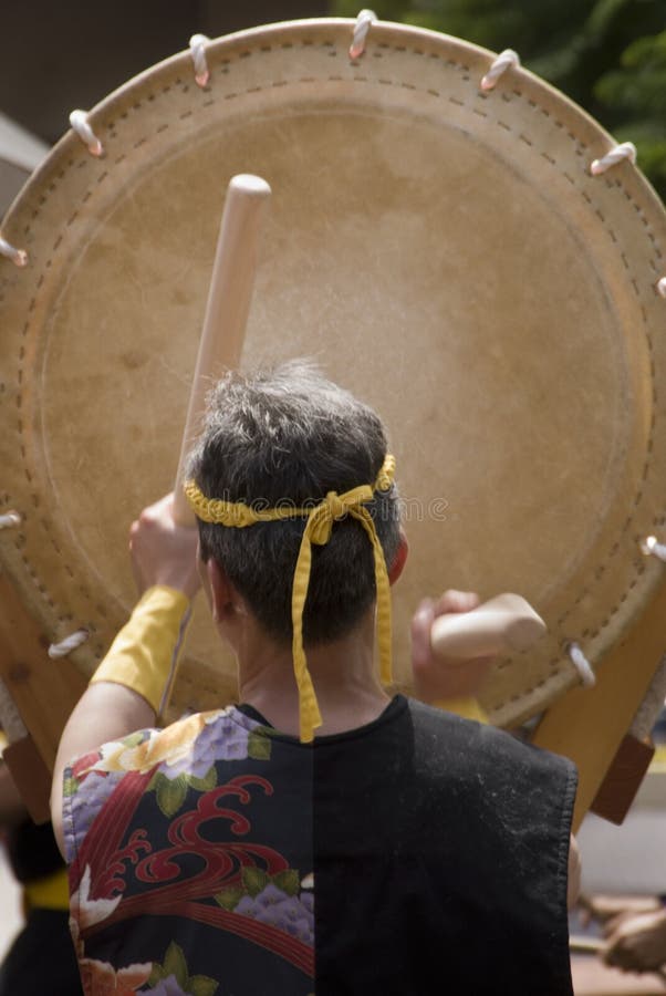 Taiko drummer hits his beats during a taiko festival. Taiko drummer hits his beats during a taiko festival.