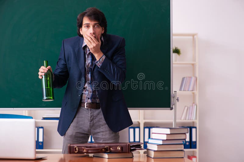 Male Teacher Drinking in the Classroom Stock Photo Image of alcohol