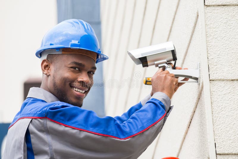 Male Technician Repairing Camera stock photos