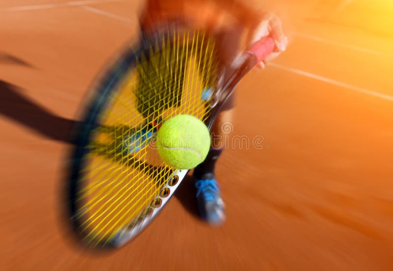 Photo of a male tennis player in action