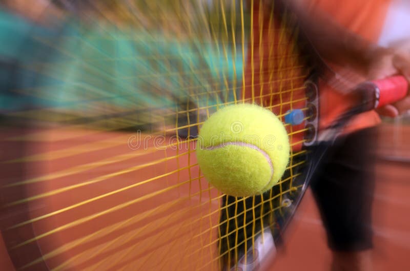 Photo of a male tennis player in action