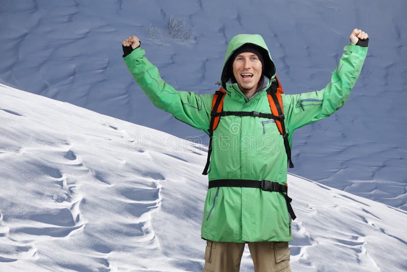 Male Tourist Climber with Arms Upraised on the Background of Snowy ...