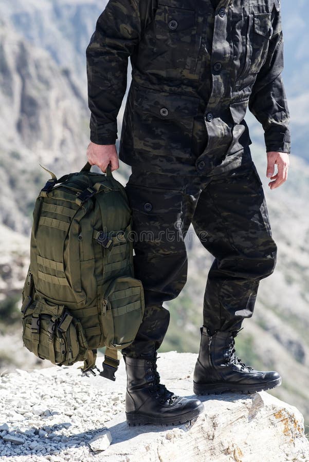 Male Tourist with a Hiking Backpack in Black Army Boots with Laces ...