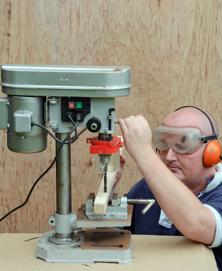 Male Using a Drill Press on Wood Stock Photo Image of handicraft