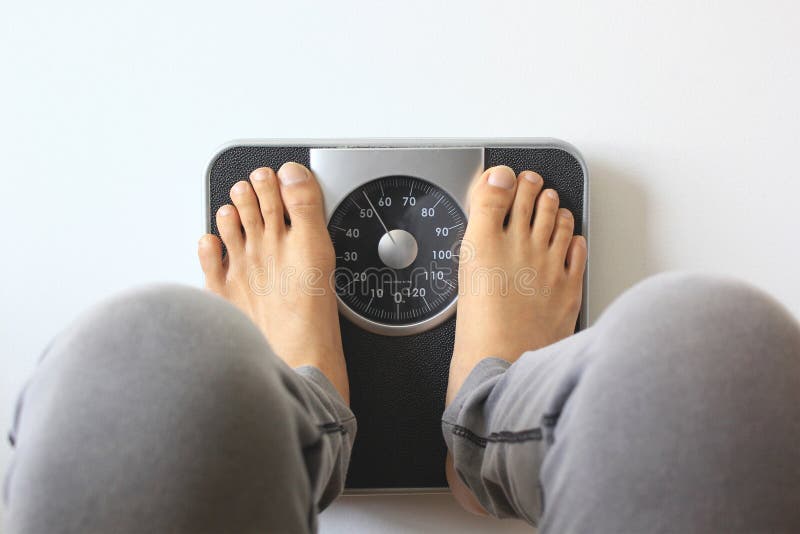 Male on the Weight Scale for Check weight , diet concept stock photography Male on the Weight Scale for Check weight , diet concept stock photography