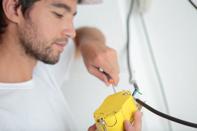 Male worker connecting wires royalty free stock photos Male worker connecting wires royalty free stock photos