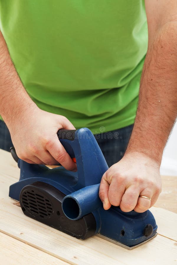 Male worker hands with electric planer royalty free stock image Male worker hands with electric planer royalty free stock image