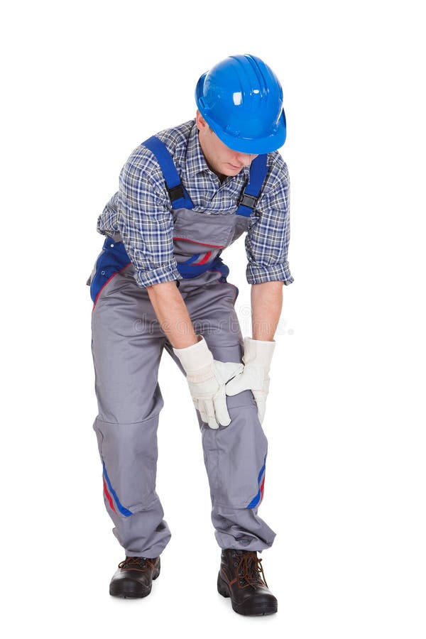 Male worker suffering from knee pain stock images Male worker suffering from knee pain stock images