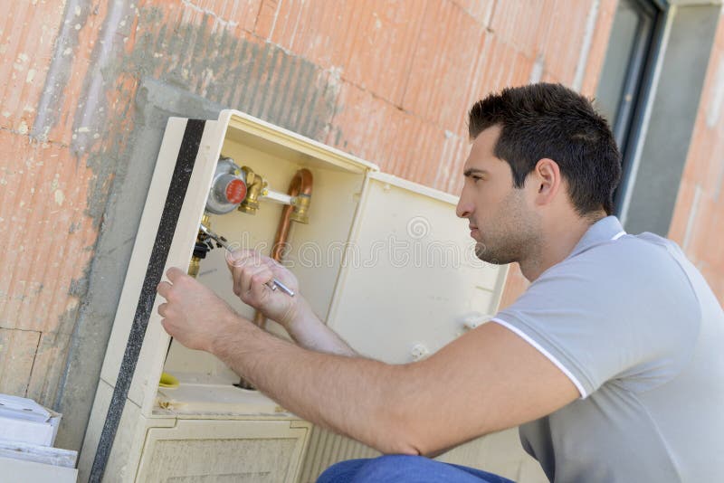 Male Worker Using Water Meter Stock Image Image of measure