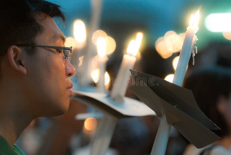 Male Worshiper with Lighted Candles