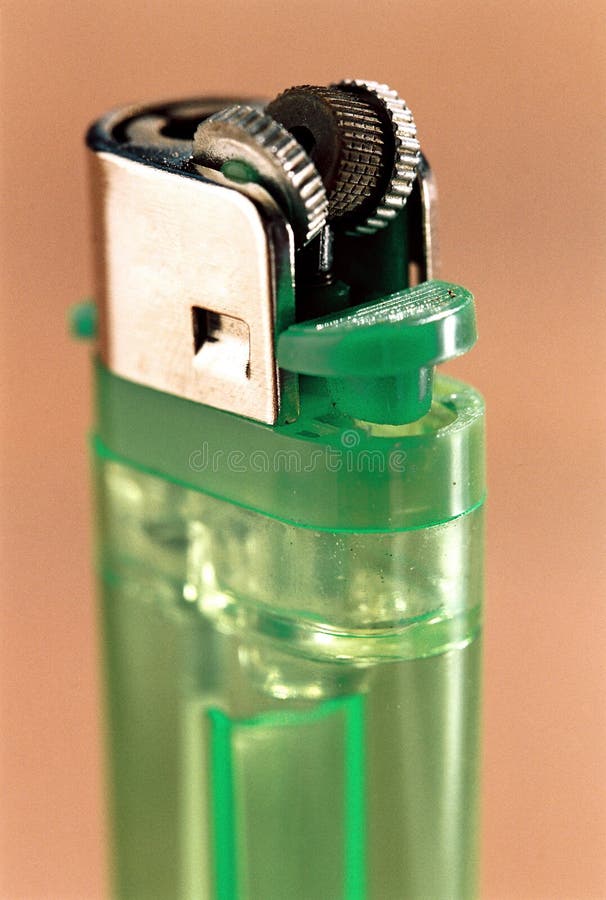 Close-up shot of green alcohol bottle with cigarette lighter and cigarettes  Stock Photo - Alamy