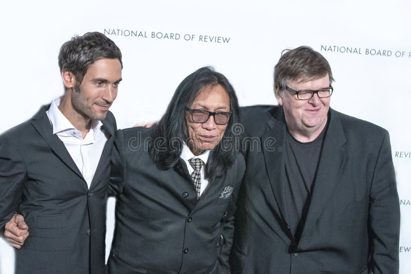 Mexican-American folk singer, songwriter, guitarist, and poet is joined by Swedish filmmaker Malik Bendjelloul and fellow Detroiter, activist and filmmaker Michael Moore at the National Board of Review gala at Cipriani's 42nd Street in Manhattan on January 8, 2013. the film documentary of his life won the NBR Best Documentary and followed up a few months later by winning the Academy Award in the same category. His first two albums were released in the early 70s and did poorly in American market despite favorable reviews. It looked as though he would have to go back to construction work in his native Detroit but was surprised to find he had become quite popular in Australia and New Zealand in 1979. In the ensuing years he was rumored to have died and a search was launched by admirers in South Africa in the 1990s. The documentary on how he was 'found' in Detroit was the Oscar-winning movie, ''Searching for Sugarman.' Bendjelloul suffered from depression and committed suicide in Stockholm in 2014. Rodriguez, who often was known just by his surname, died on August 8, 2023, at the age of 81. Mexican-American folk singer, songwriter, guitarist, and poet is joined by Swedish filmmaker Malik Bendjelloul and fellow Detroiter, activist and filmmaker Michael Moore at the National Board of Review gala at Cipriani's 42nd Street in Manhattan on January 8, 2013. the film documentary of his life won the NBR Best Documentary and followed up a few months later by winning the Academy Award in the same category. His first two albums were released in the early 70s and did poorly in American market despite favorable reviews. It looked as though he would have to go back to construction work in his native Detroit but was surprised to find he had become quite popular in Australia and New Zealand in 1979. In the ensuing years he was rumored to have died and a search was launched by admirers in South Africa in the 1990s. The documentary on how he was 'found' in Detroit was the Oscar-winning movie, ''Searching for Sugarman.' Bendjelloul suffered from depression and committed suicide in Stockholm in 2014. Rodriguez, who often was known just by his surname, died on August 8, 2023, at the age of 81.