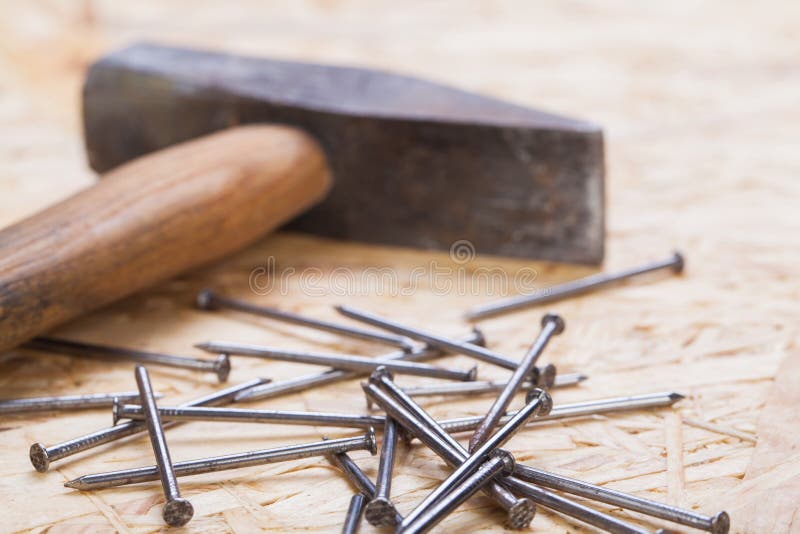 Mallet with nails and planks of new wood stock photo