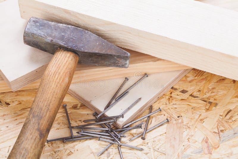 Mallet with nails and planks of new wood royalty free stock image