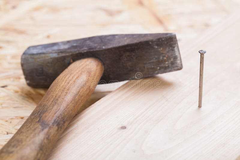 Mallet with nails and planks of new wood stock images