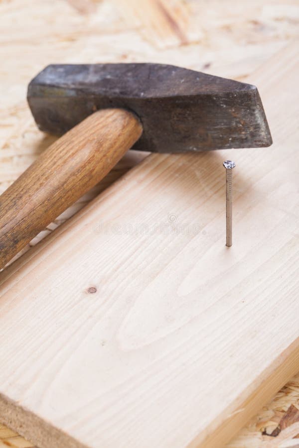 Mallet with nails and planks of new wood stock image