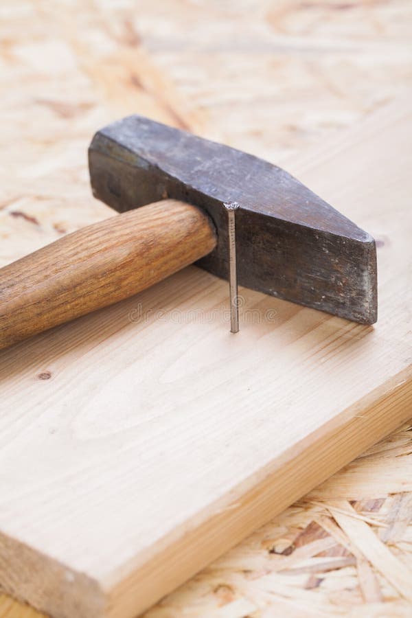 Mallet with nails and planks of new wood royalty free stock image
