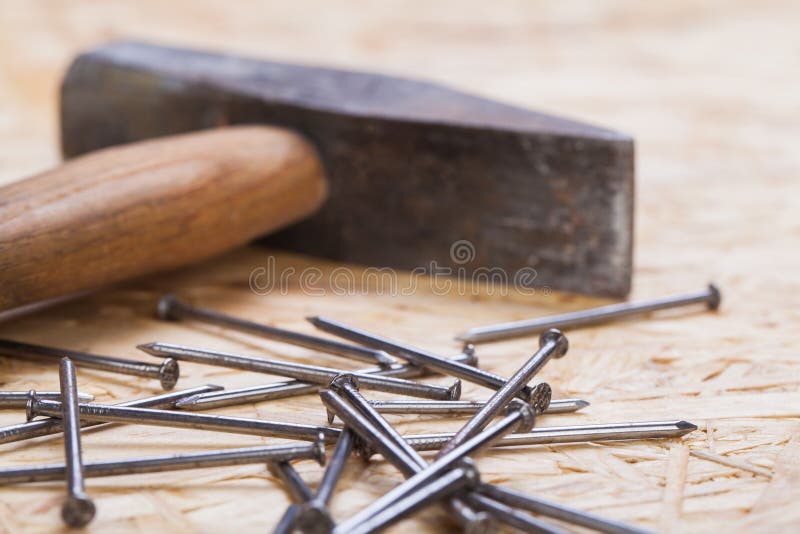 Mallet with nails and planks of new wood royalty free stock photography
