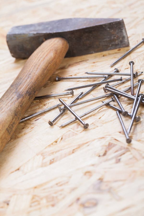 Mallet with nails and planks of new wood royalty free stock photo