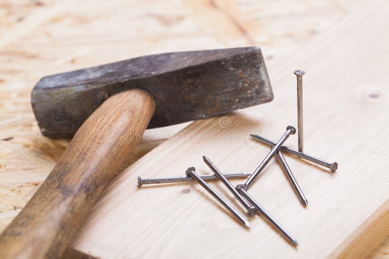 Mallet with nails and planks of new wood royalty free stock photos