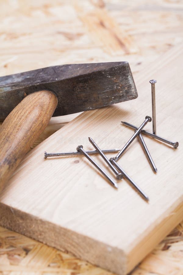 Mallet with nails and planks of new wood royalty free stock image