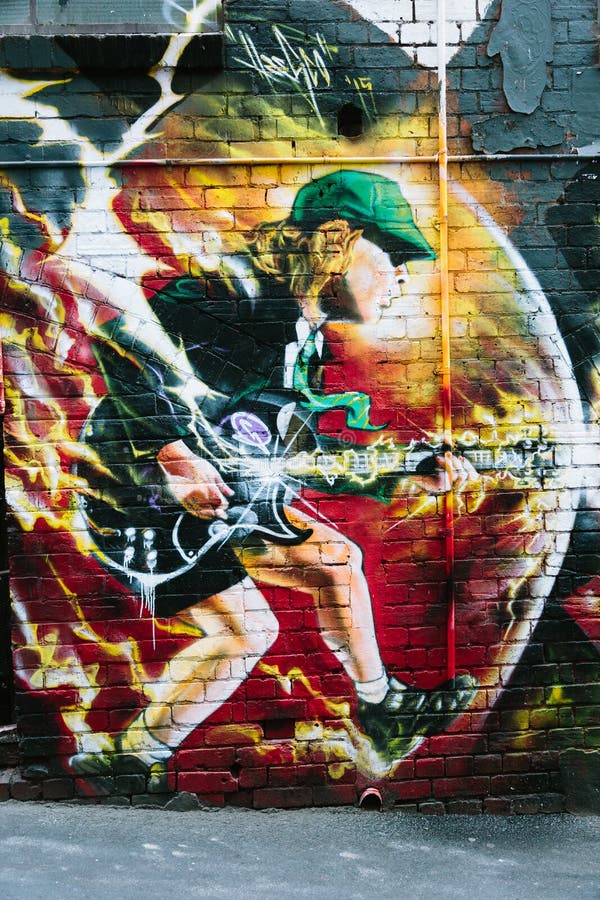 MELBOURNE/AUSTRALIA - FEBRUARY 6: Taken in Melbourne's famous graffiti laneways, this mural of AC/DC's Angus YOung was found in AC/DC Lane, Mlebourne. MELBOURNE/AUSTRALIA - FEBRUARY 6: Taken in Melbourne's famous graffiti laneways, this mural of AC/DC's Angus YOung was found in AC/DC Lane, Mlebourne.