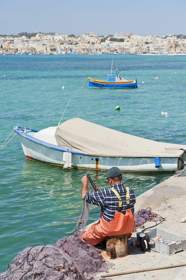 Maltese Fisherman Repairing His Nets Editorial Photography - Image