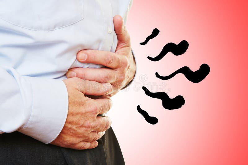 Man with abdominal pain in stomach holding hands on his belly. Spasm ache stock images, royalty-free photos and pictures