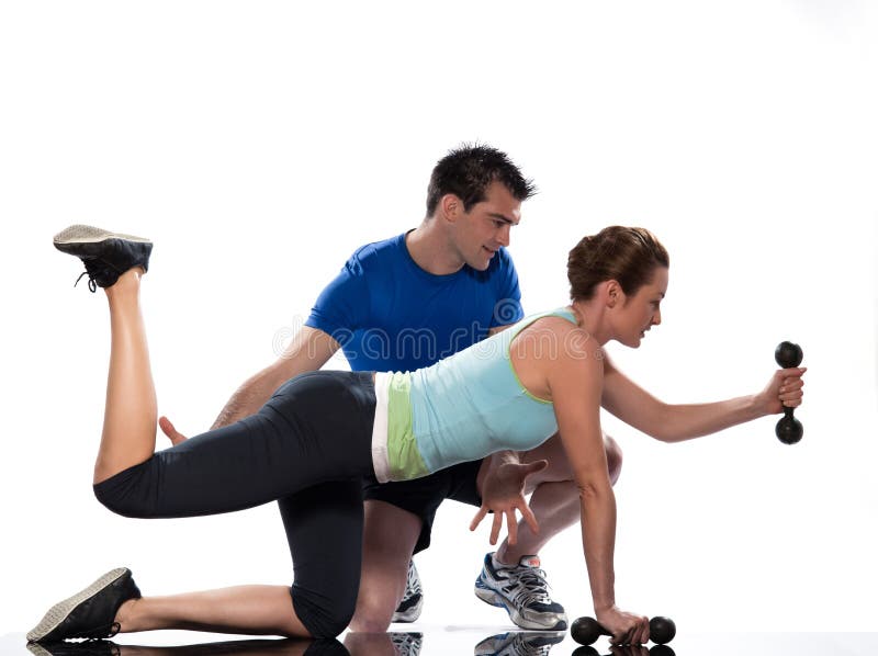 Man aerobic trainer positioning woman Workout royalty free stock photo