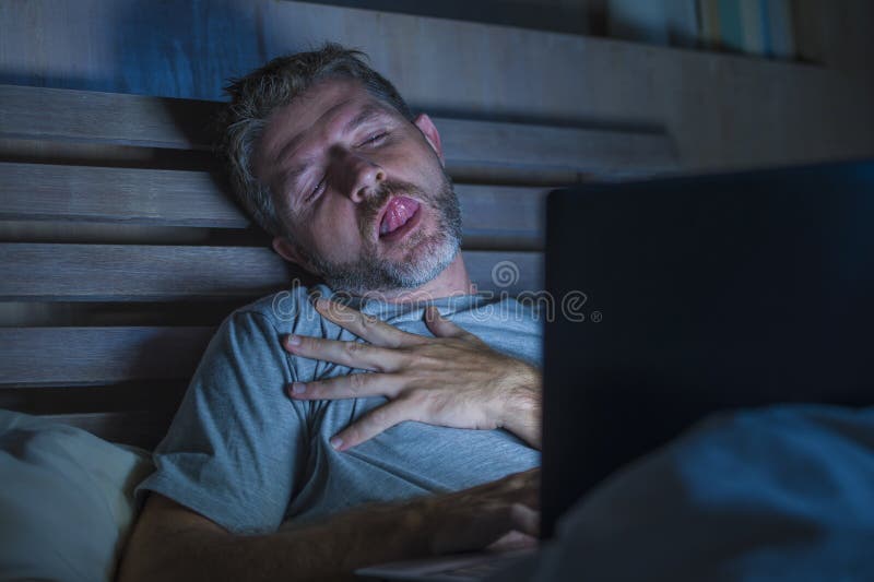 Man Alone in Bed Playing Cybersex Using Laptop Computer Watching Sex Movie  Late at Night with Lascivious Pervert Face Stock Image - Image of computer,  millennial: 134655007