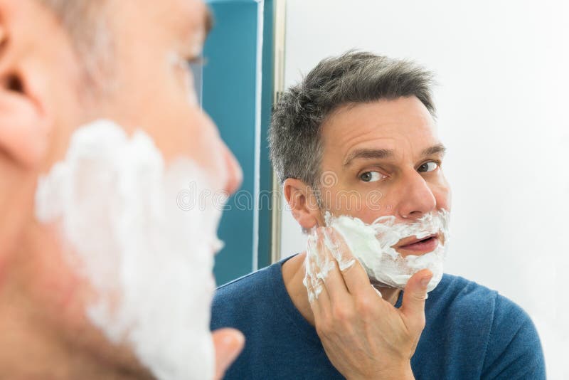 Man applying shaving cream stock image. Image of healthy 54932579