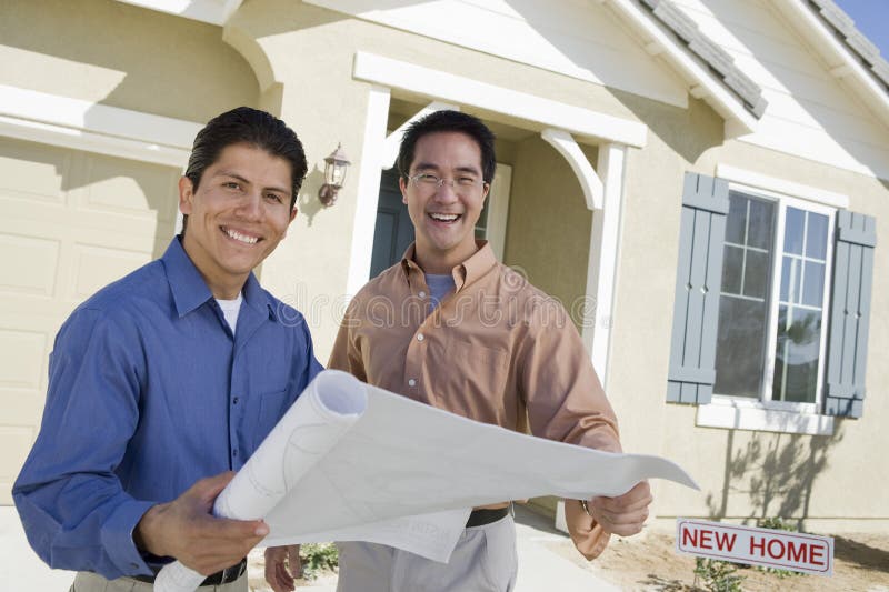 Portrait of men with architect holding blueprint discussing new house design. Portrait of men with architect holding blueprint discussing new house design