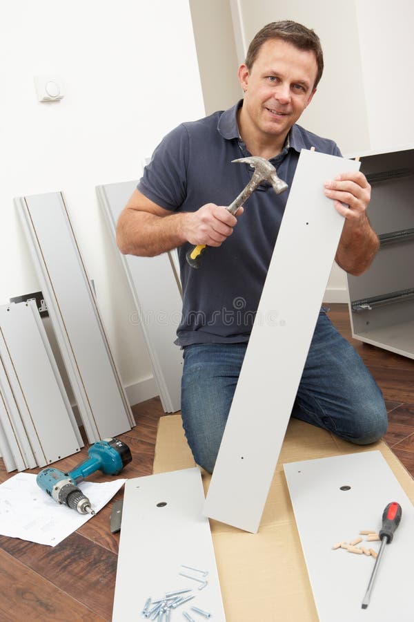 Man Assembling Flat Pack Furniture royalty free stock image Man Assembling Flat Pack Furniture royalty free stock image