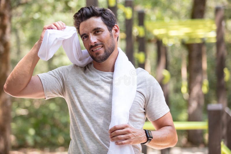 Man athlete with towel nature background stock image