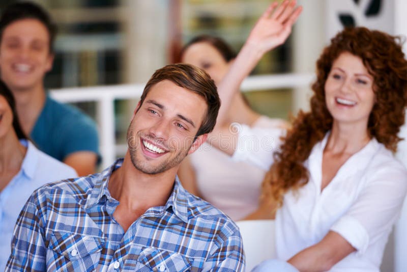 Man, audience and laughing at meeting at office with staff, group and presentation for business people. Person, smile royalty free stock photo