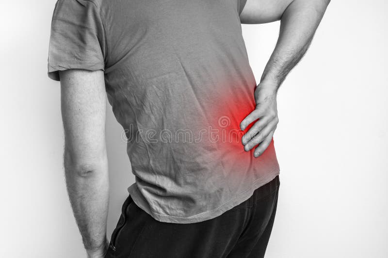 Man with back pain - black and white photo stock image