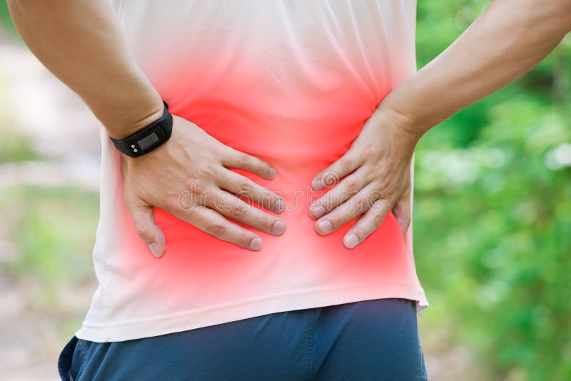 Man with back pain, kidney inflammation, trauma during workout, outdoors concept