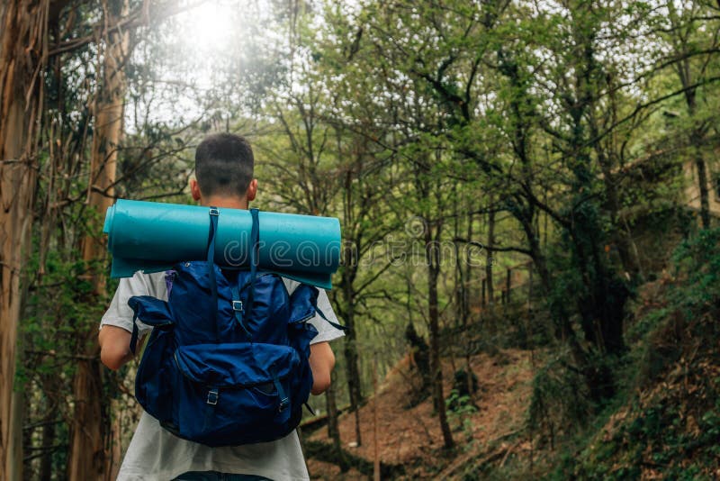 Man with Backpack Doing Trekking or Hiking Stock Image Image of