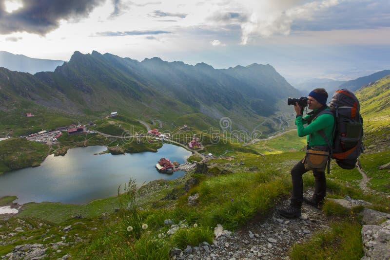 Man with backpack on the mountain stock images Man with backpack on the mountain stock images