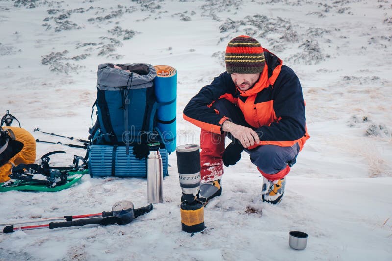 Man Cooking Food while Hiking in Winter Mountain Stock Photo - Image of ...